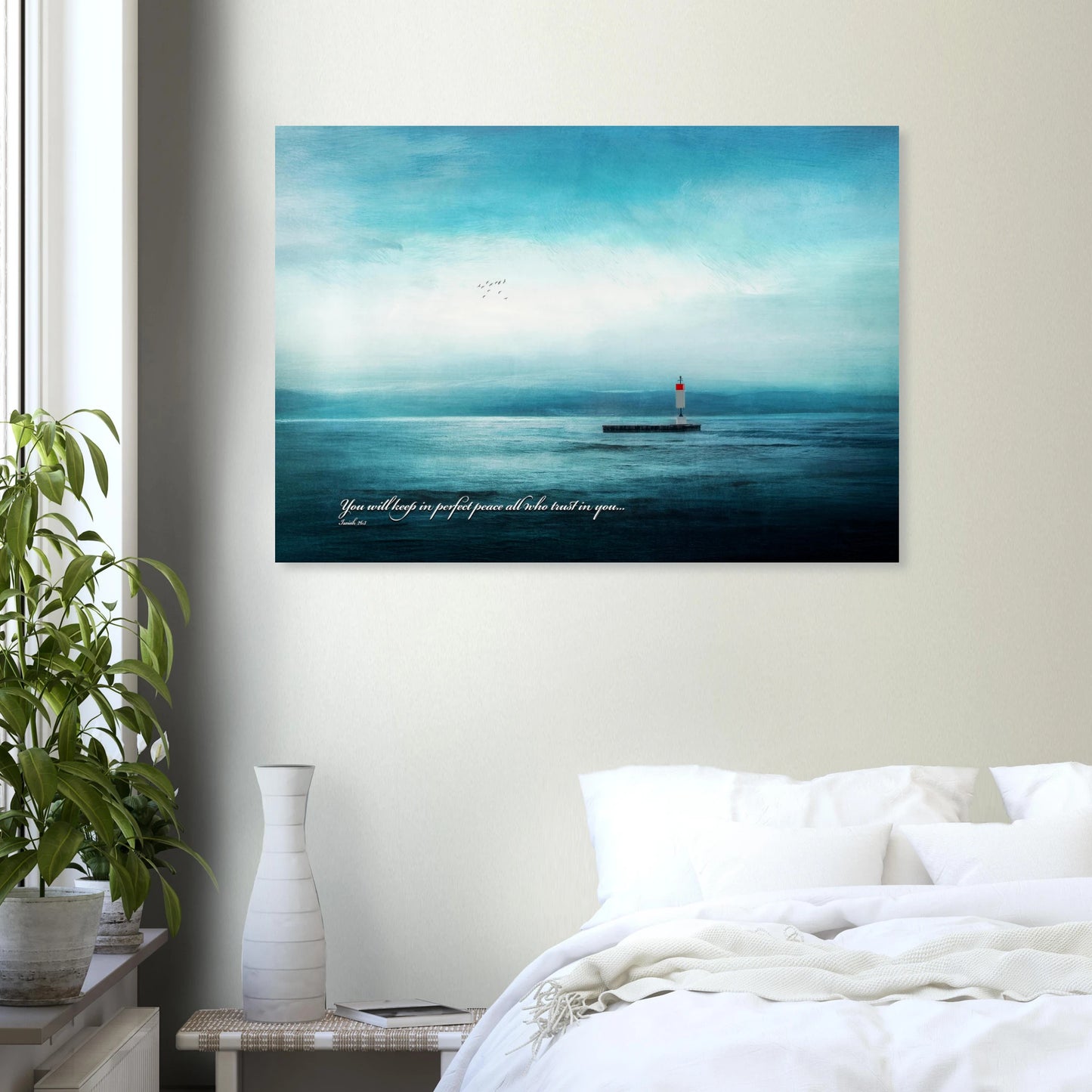 Christian wall art featuring a peaceful ocean scene with a distant lighthouse and Isaiah 26:3 displayed above a cozy bedroom setting