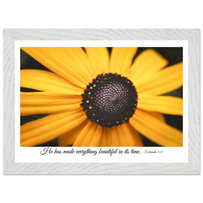 A framed art print of a close-up yellow flower with a quote from Ecclesiastes 3:11, 'He has made everything beautiful in its time.'.