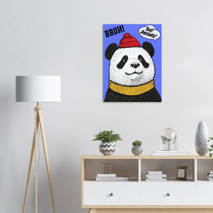A canvas wall art featuring a cartoon illustration of a panda with a red beanie hat, a yellow scarf, and a speech bubble saying 'Trust Jesus' with a blue background displayed in a bright minimalist room with a small decors.