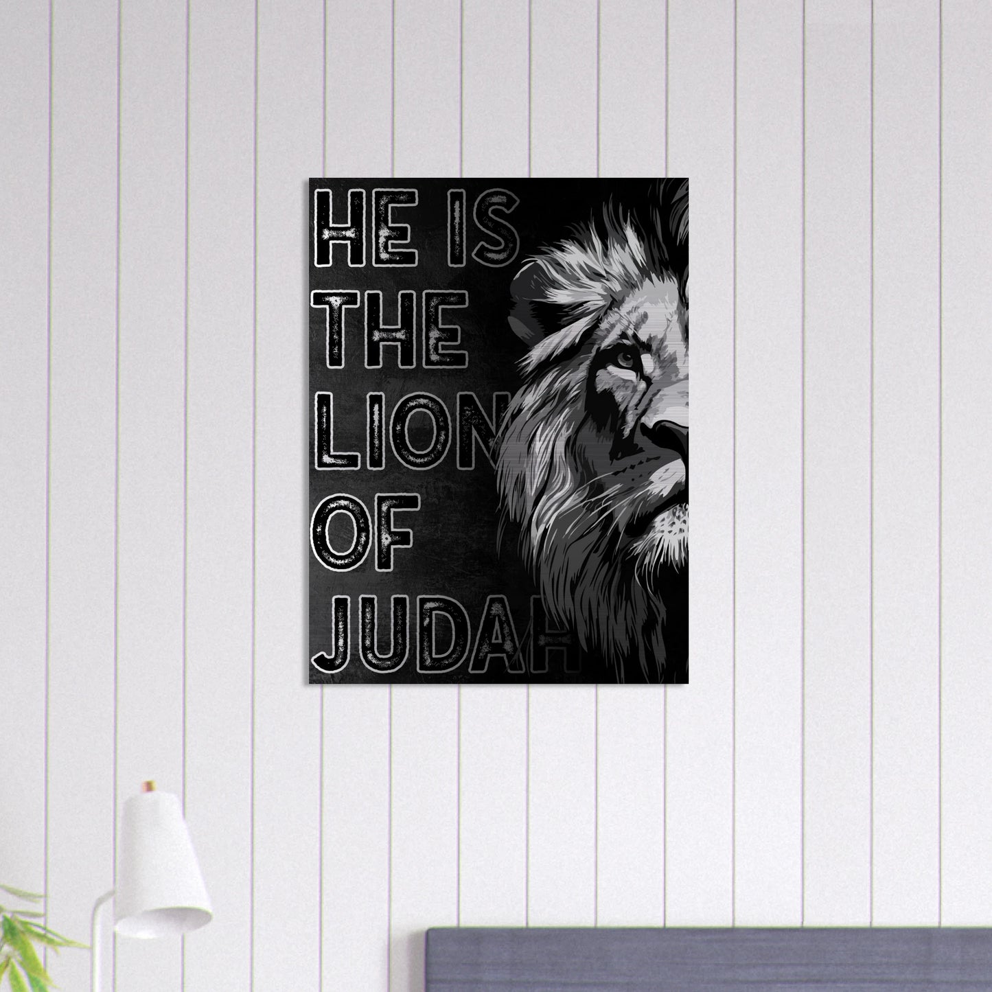 Black and white Lion of Judah Christian wall art with bold lettering and a half-lion illustration, displayed on a white shiplap wall above a modern bedroom setup.