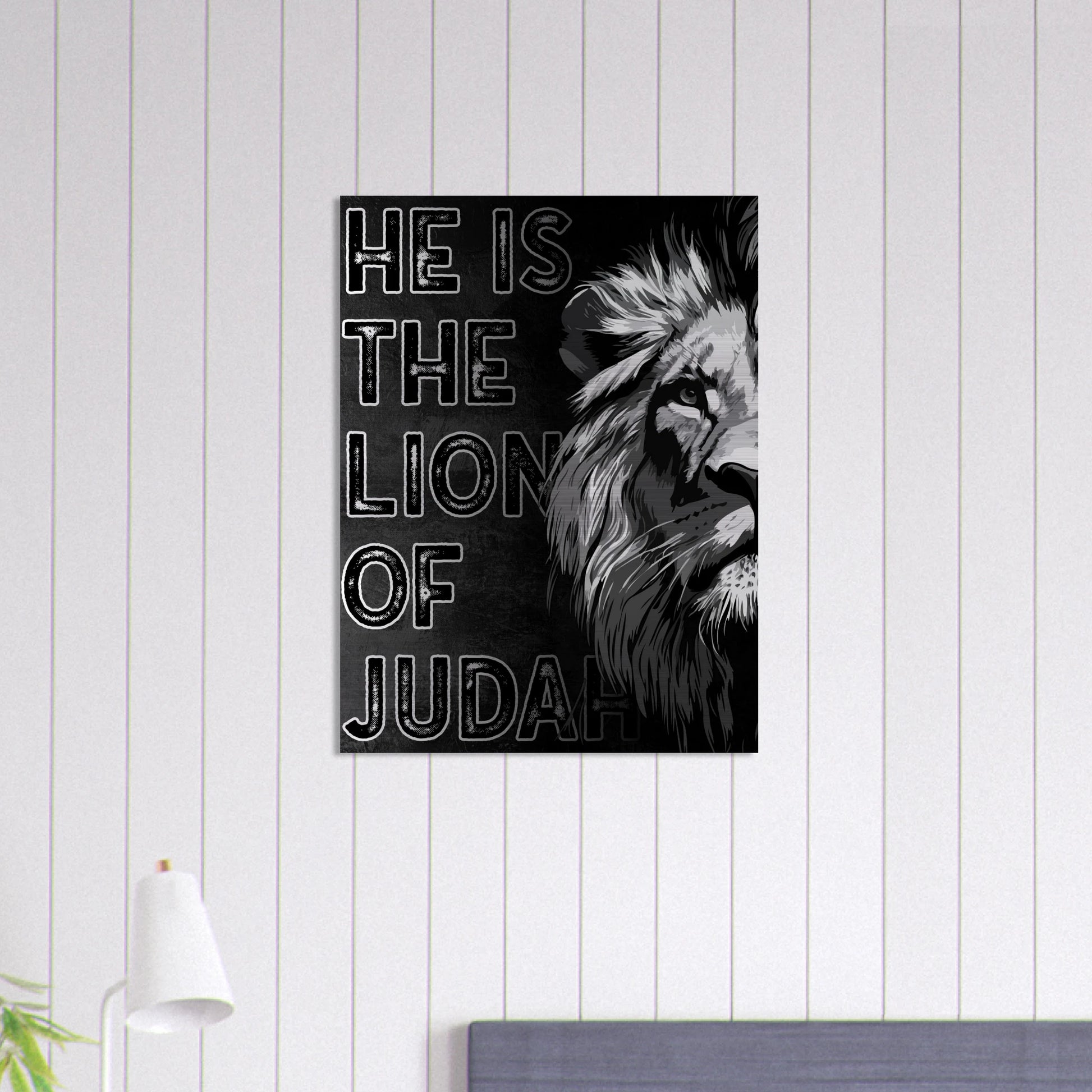 Black and white Lion of Judah Christian wall art with bold lettering and a half-lion illustration, displayed on a white shiplap wall above a modern bedroom setup.