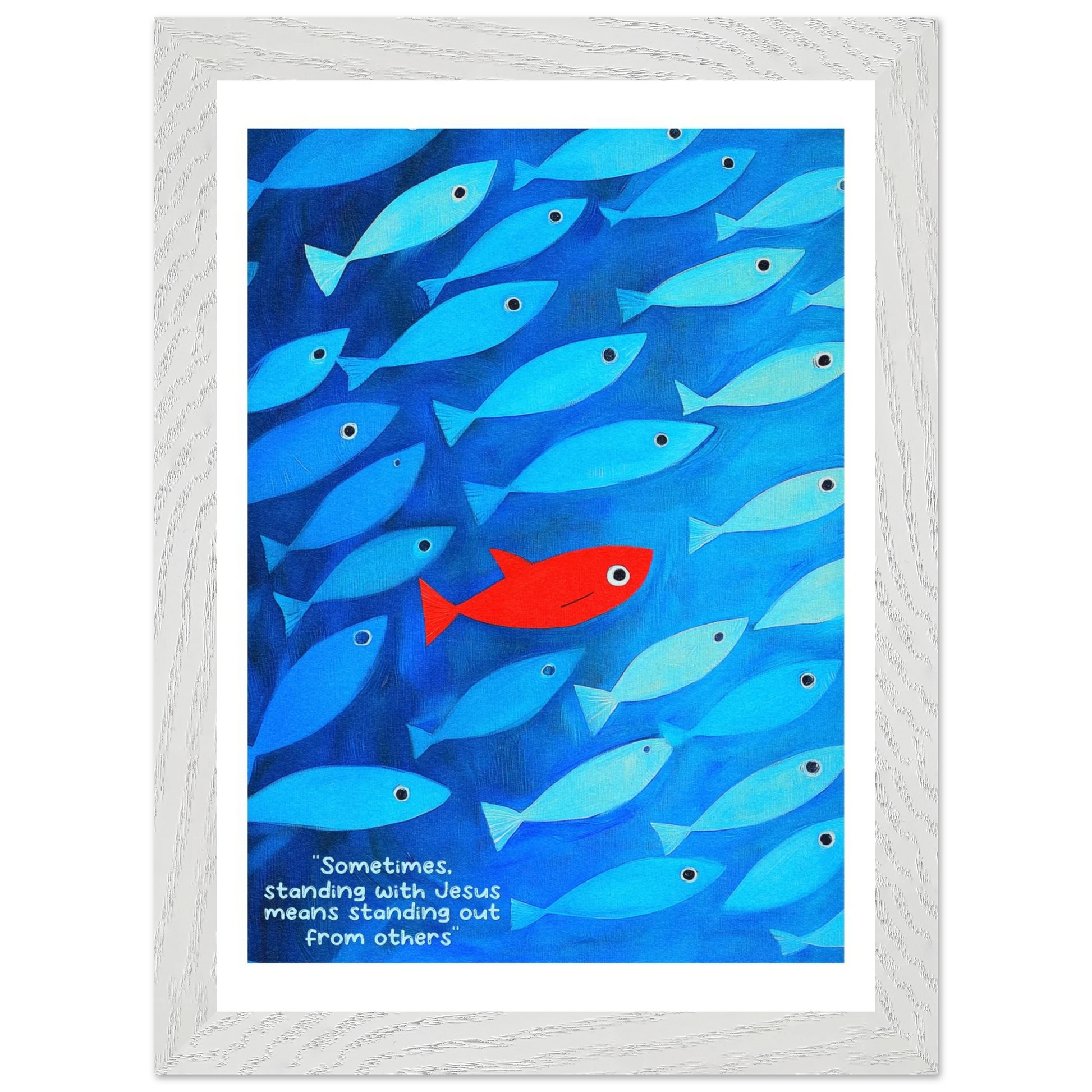 Framed wall art featuring a school of blue fish with a single red fish, and text that reads: 'Sometimes standing with Jesus means standing out from others.'.
