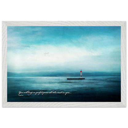 A framed poster featuring a lighthouse in a serene seascape with the text 'You will keep in perfect peace all who trust in you.' from Isaiah 26:3.