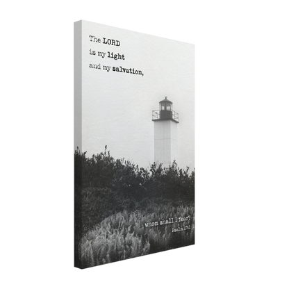 A canvas wall art print featuring a lighthouse with a black and white coastal landscape and the text of Psalm 27:1 which reads 'The Lord is my light and my salvation.'.