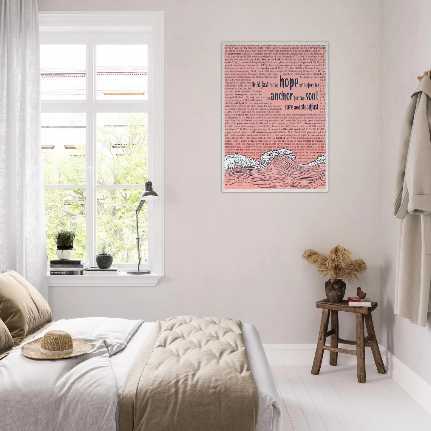 framed pink christian wall art with wave and anchor design and bible verse hanging in a bright cozy bedroom