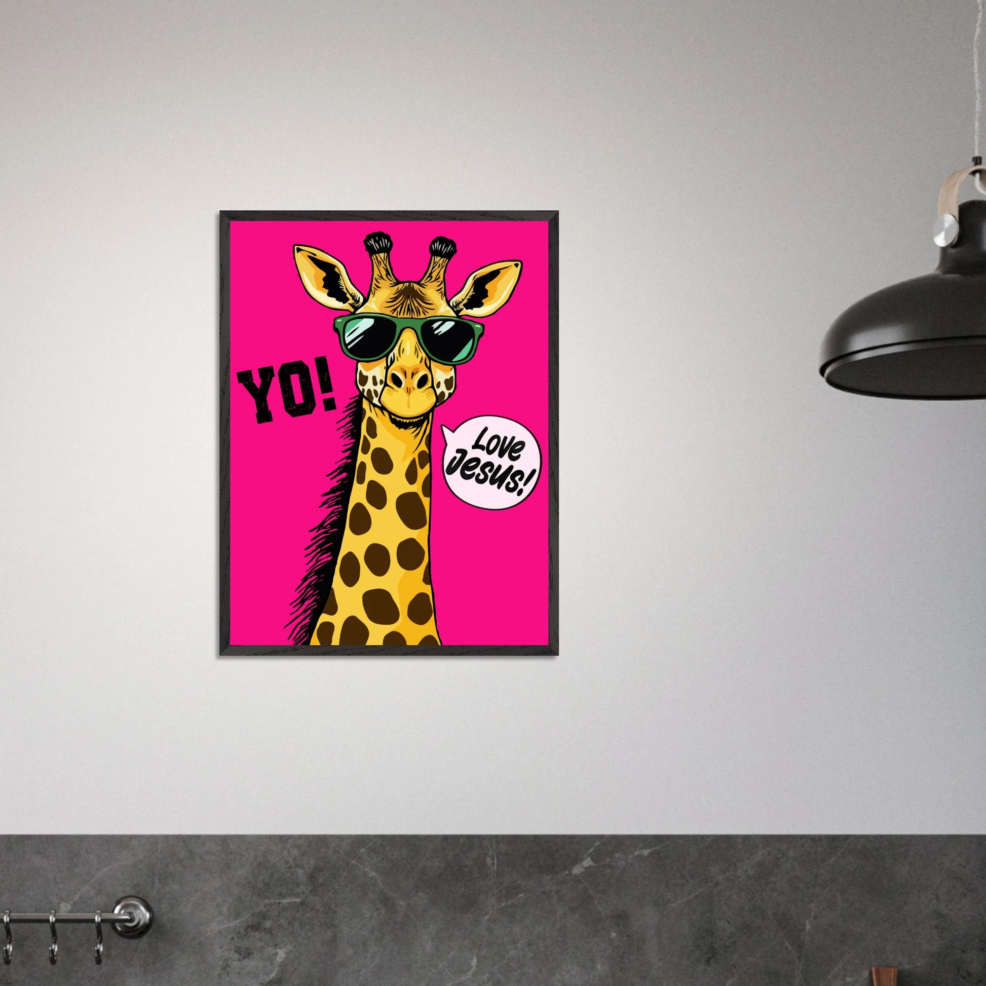 Playful Christian wall art featuring a giraffe wearing sunglasses on a bright pink background with Yo and Love Jesus displayed in a modern minimalist room