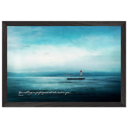 A framed poster featuring a lighthouse in a serene seascape with the text 'You will keep in perfect peace all who trust in you.' from Isaiah 26:3.