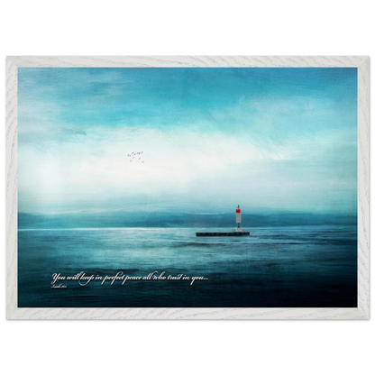 A framed poster featuring a lighthouse in a serene seascape with the text 'You will keep in perfect peace all who trust in you.' from Isaiah 26:3.