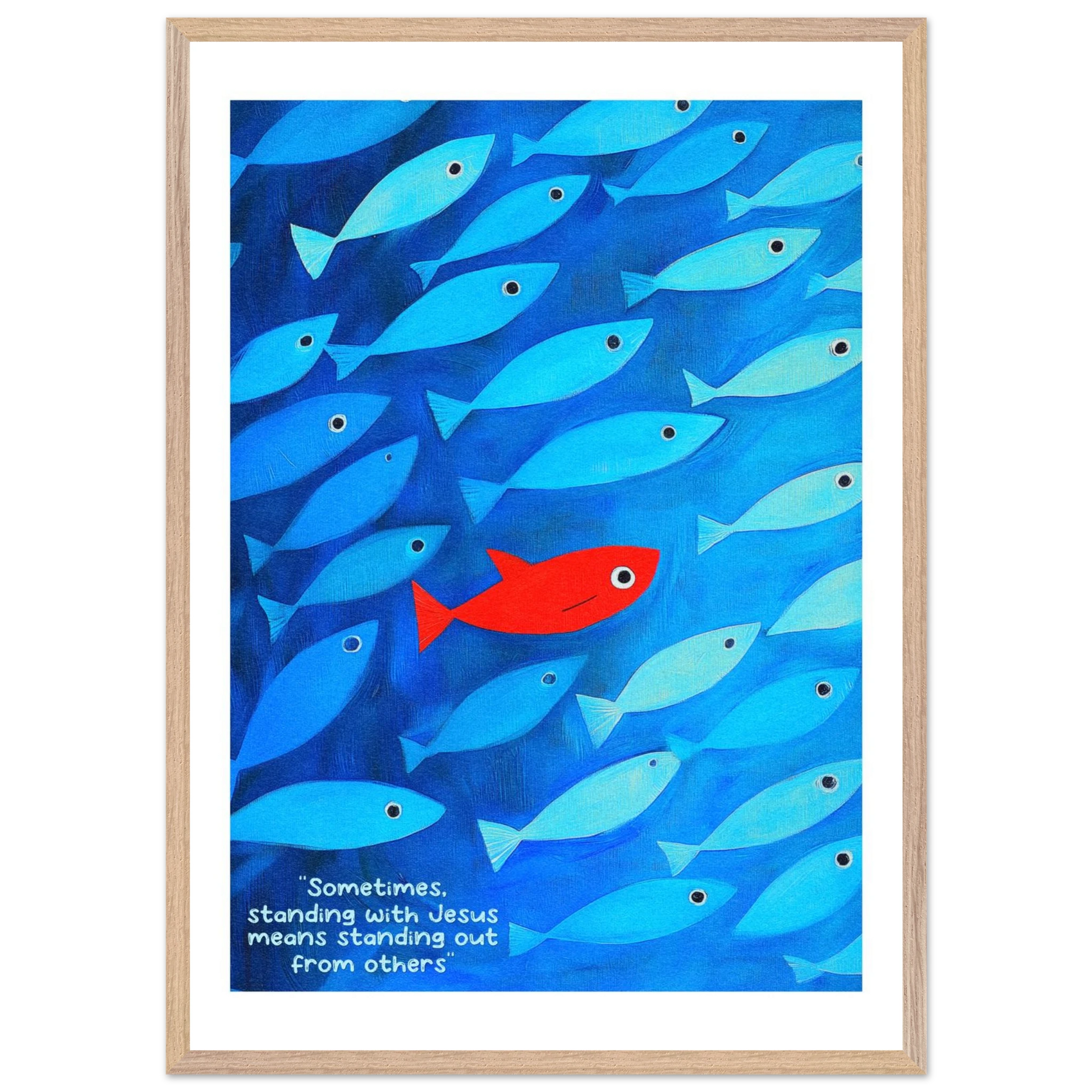Framed wall art featuring a school of blue fish with a single red fish, and text that reads: 'Sometimes standing with Jesus means standing out from others.'.