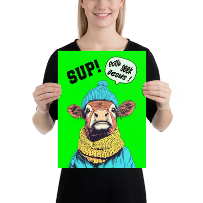 Person holding a poster with a cow wearing a blue beanie and yellow scarf on a green background.
