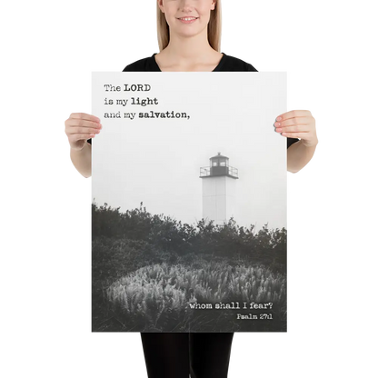 Person holding a poster with a lighthouse and religious text