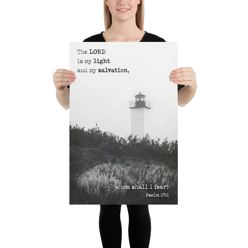 Person holding a poster with a lighthouse and religious text against a white background