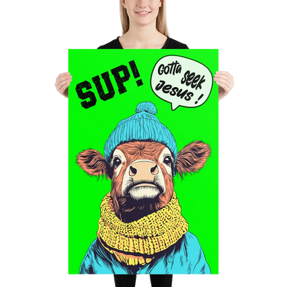 Person holding a poster with a cow wearing a blue hat and yellow scarf on a green background.