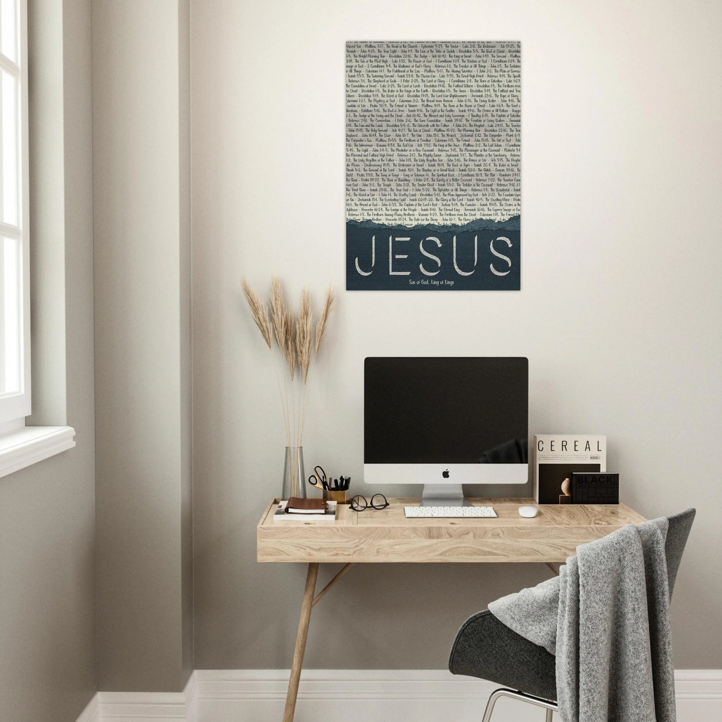 jesus christian metal print with scriptural titles displayed above a minimalist desk workspace