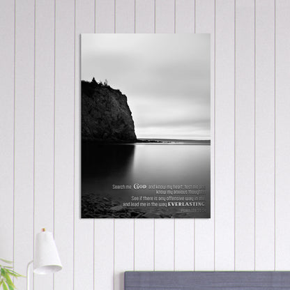 Framed black and white landscape print with text on a white wall.