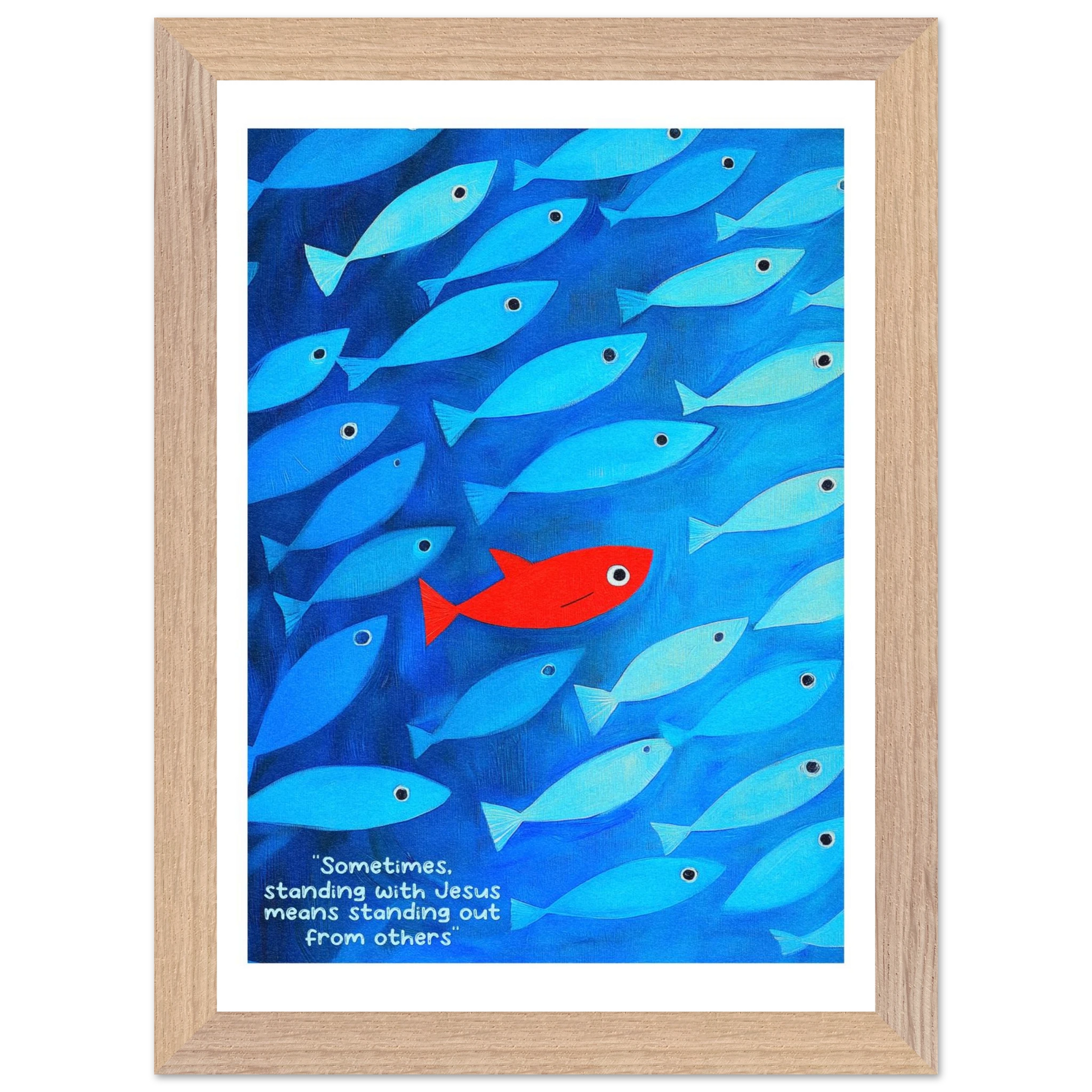 Framed wall art featuring a school of blue fish with a single red fish, and text that reads: 'Sometimes standing with Jesus means standing out from others.'.