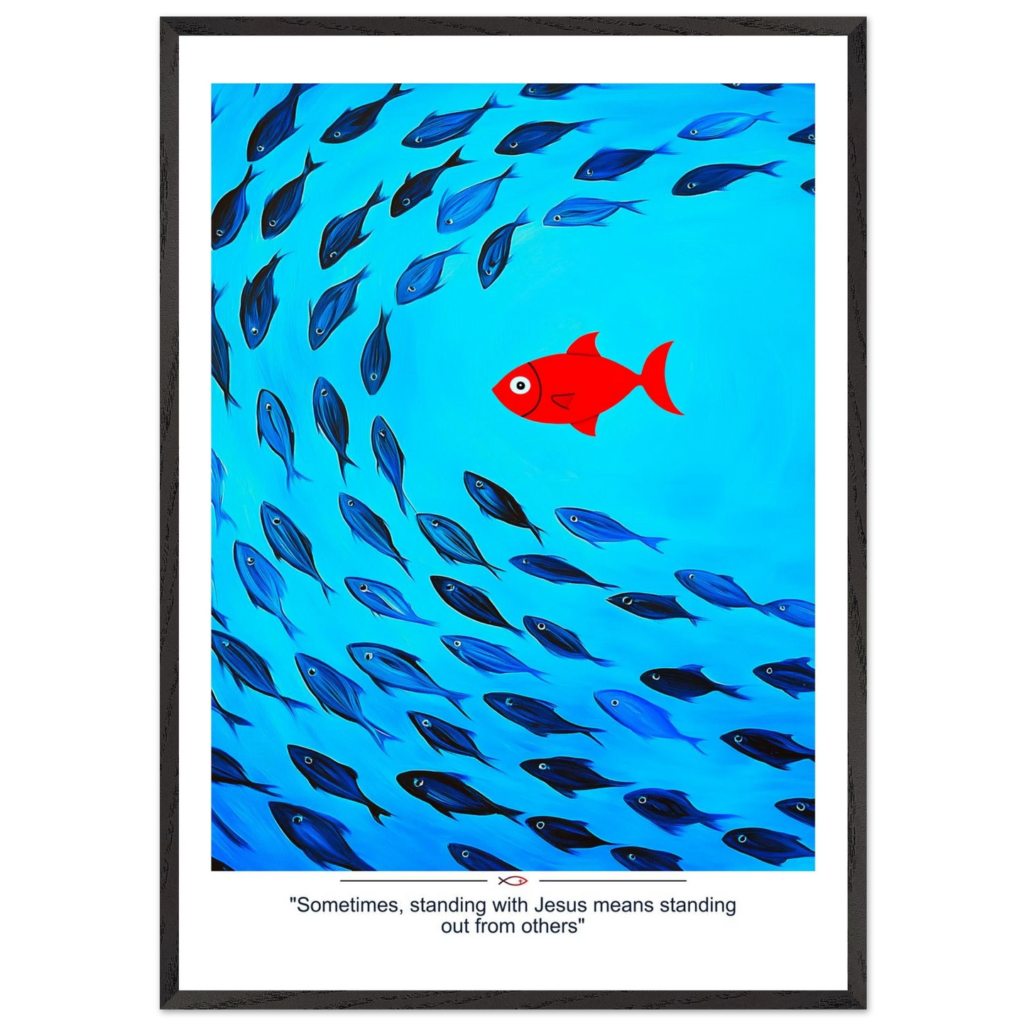 Framed Christian wall art featuring a red fish swimming in water with blue fish, and the text 'Sometimes standing with Jesus means standing out from others' as a quote.