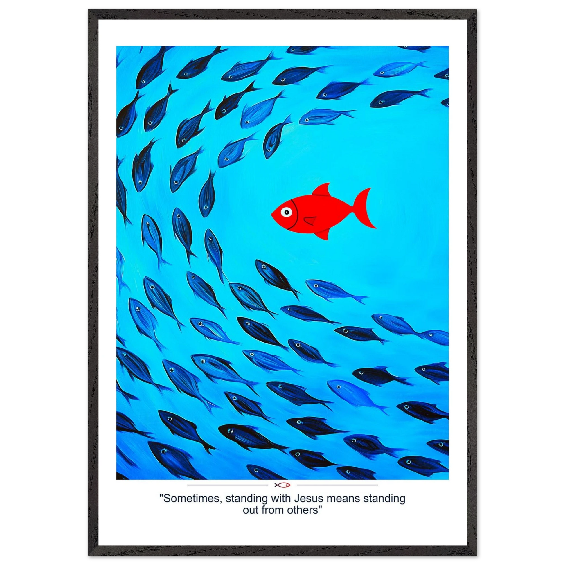 Framed Christian wall art featuring a red fish swimming in water with blue fish, and the text 'Sometimes standing with Jesus means standing out from others' as a quote.