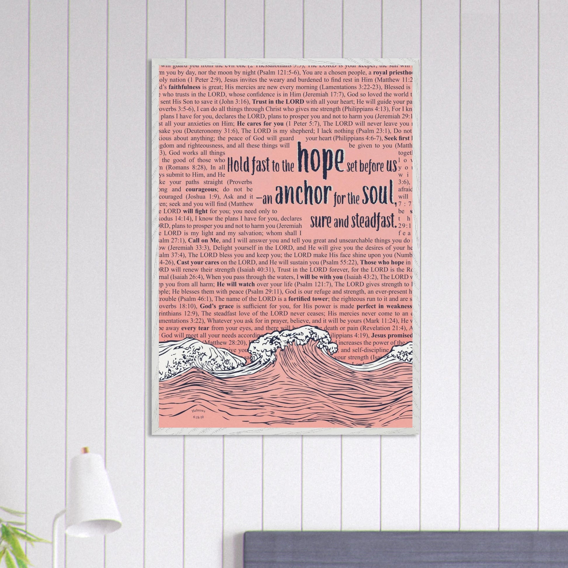 pink framed christian wall art featuring waves and anchor with scripture text hanging on a white shiplap wall