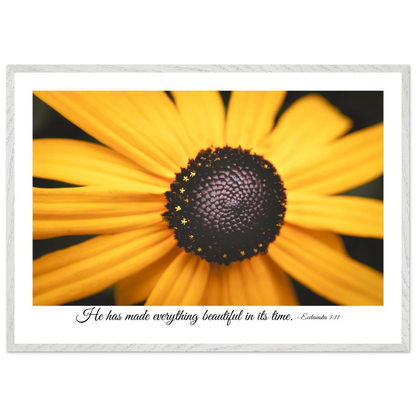 A framed art print of a close-up yellow flower with a quote from Ecclesiastes 3:11, 'He has made everything beautiful in its time.'.