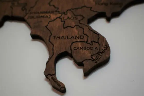 Wooden map of Southeast Asia with Thailand, Cambodia, and Vietnam labeled.