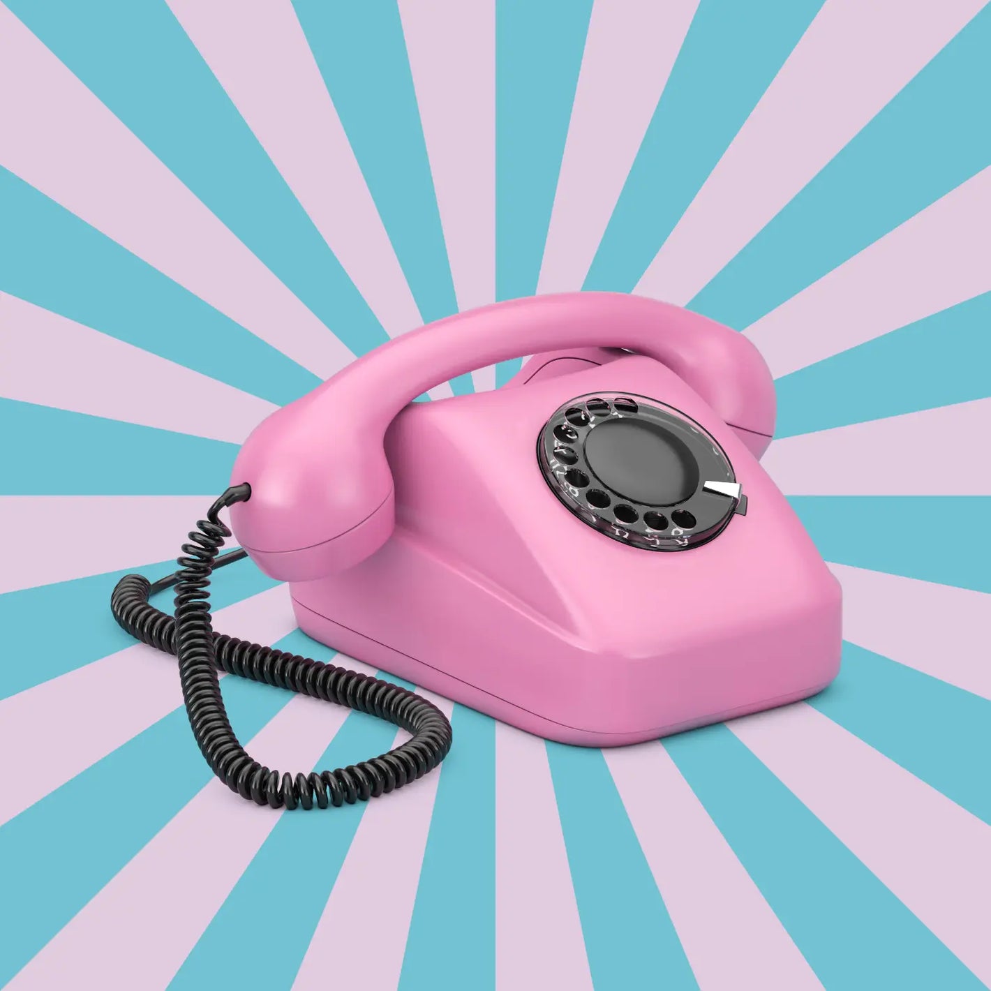 Pink vintage telephone on a blue and pink striped background