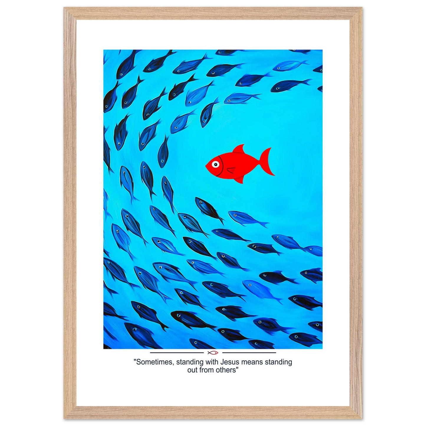 Framed Christian wall art featuring a red fish swimming in water with blue fish, and the text 'Sometimes standing with Jesus means standing out from others' as a quote.
